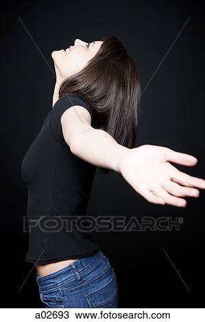 Stock Image - Woman with outstretched arms. Fotosearch