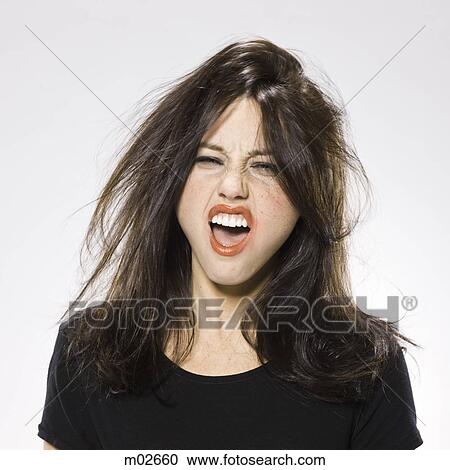 Stock Image - woman with wild hair and appearance. Fotosearch