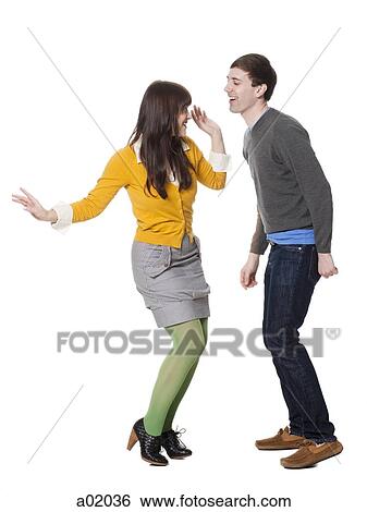Young couple dancing, studio shot View Large Photo Image Stock Photograph - Young couple dancing, studio shot. Fotosearch