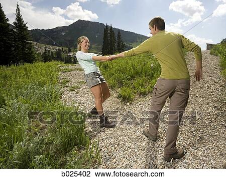 young couple on a hiking trip View Large Photo Image Stock Image - young couple on a hiking trip. Fotosearch