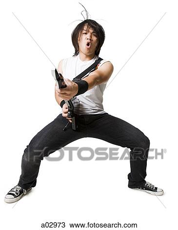 Young man playing guitar video game, portrait View Large Photo Image Stock Image - Young man playing guitar video game, portrait. Fotosearch