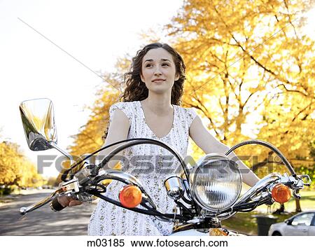 Young woman driving motorcycle View Large Photo Image Stock Photography - Young woman driving motorcycle. Fotosearch