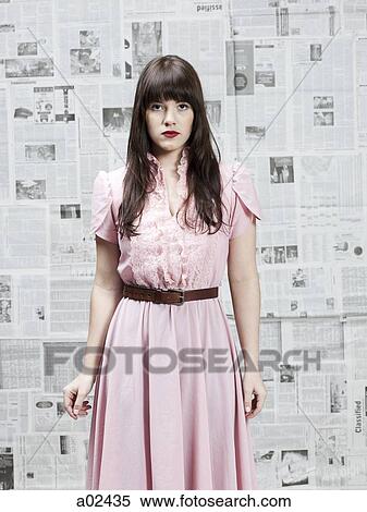 Stock Photography - Young woman in retro dress, portrait. Fotosearch