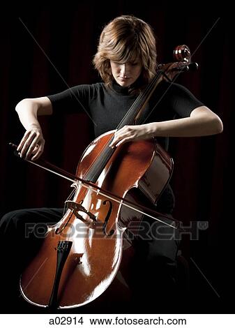Picture - Young woman playing cello. Fotosearch