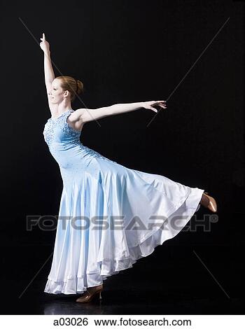 Young woman posing as professional dancer, studio shot View Large Photo Image Stock Photograph - Young woman posing as professional dancer, studio shot. Fotosearch