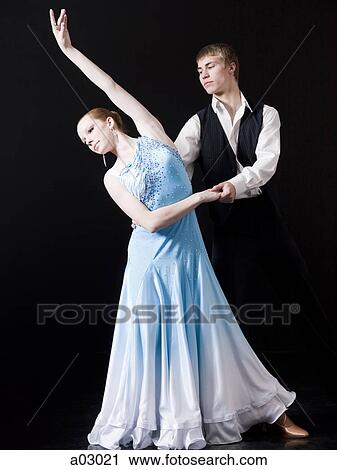 Young woman posing with teenage boy (16-17) as two professional dancers, studio shot View Large Photo Image Stock Image - Young woman posing with teenage boy (16-17) as two professional dancers, studio shot. Fotosearch