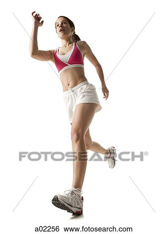 Stock Photograph - Young woman running, on white background. Fotosearch