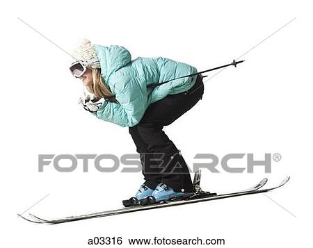 Stock Photograph - Young woman skiing, studio shot. Fotosearch