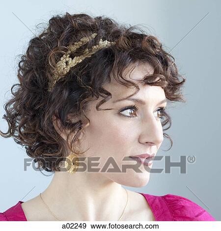 Young woman smiling, portrait, studio shot View Large Photo Image Stock Photo - Young woman smiling, portrait, studio shot. Fotosearch