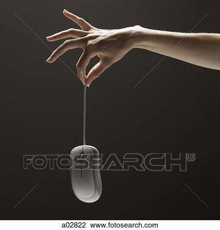 Young woman's hand holding computer mouse View Large Photo Image Stock Image - Young woman's hand holding computer mouse. Fotosearch