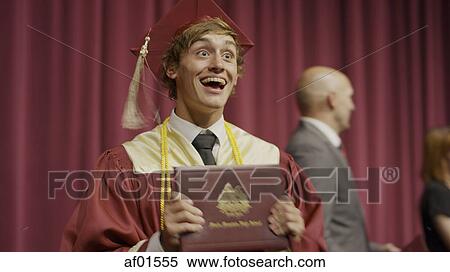Blurred view of cheering student holding diploma on stage during graduation ceremony View Large Photo Image Stock Photography - Blurred view of cheering student holding diploma on stage during graduation ceremony. Fotosearch