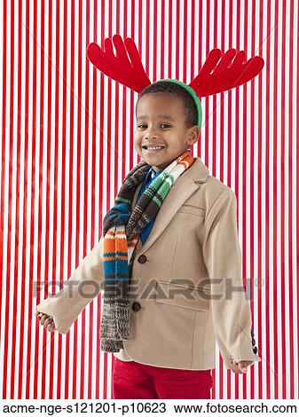 Boy (4-5) wearing reindeer antlers, studio shot View Large Photo Image Stock Image - Boy (4-5) wearing reindeer antlers, studio shot. Fotosearch