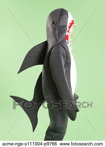 Boy (6-7) in shark costume for Halloween View Large Photo Image Stock Photograph - Boy (6-7) in shark costume for Halloween. Fotosearch
