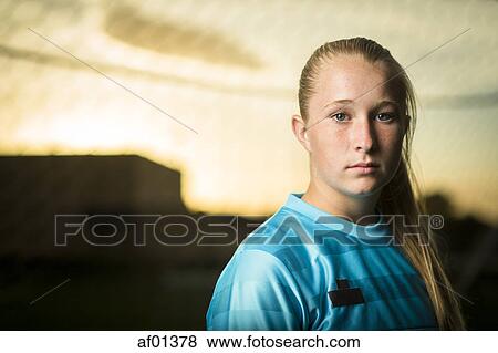 Close up portrait of serious athlete under sunset sky View Large Photo Image Stock Photo - Close up portrait of serious athlete under sunset sky. Fotosearch