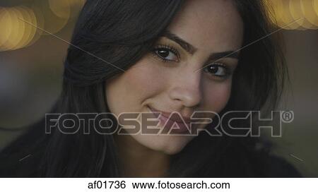Close up portrait of smiling woman with long brown hair View Large Photo Image Stock Photograph - Close up portrait of smiling woman with long brown hair. Fotosearch
