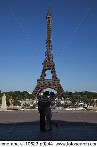 France, Couple kissing near Eiffel Tower View Large Photo Image Picture - France, Couple kissing near Eiffel Tower. Fotosearch
