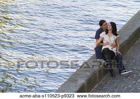 France, Paris, Seine River, Young couple relaxing on promenade View Large Photo Image Stock Image - France, Paris, Seine River, Young couple relaxing on promenade. Fotosearch