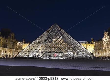 Stock Image - France, Paris, The Louvre at night. Fotosearch