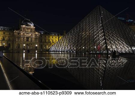 Stock Photo - France, Paris, The Louvre at night. Fotosearch