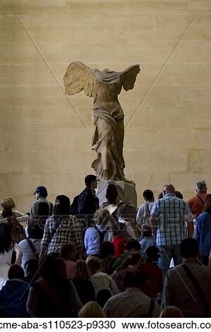 France, Paris, The Louvre, Tourists looking at Winged Victory of Samothrace View Large Photo Image Stock Image - France, Paris, The Louvre, Tourists looking at Winged Victory of Samothrace. Fotosearch