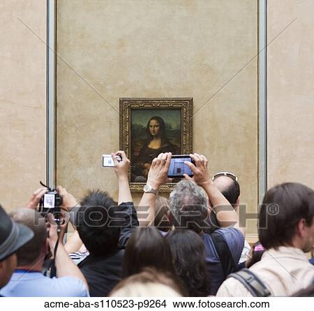 Picture - France, Paris, Tourists photographing Mona Lisa painting. Fotosearch