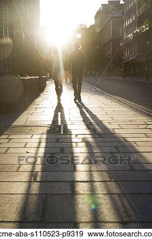 France, Paris, Young couple walking in street View Large Photo Image Stock Photo - France, Paris, Young couple walking in street. Fotosearch