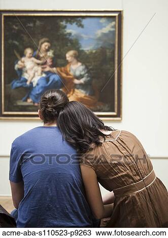 France, Paris, Young couple watching paintings in Louvre Museum View Large Photo Image Stock Image - France, Paris, Young couple watching paintings in Louvre Museum. Fotosearch