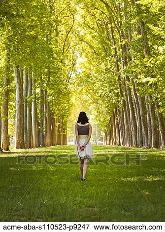 France, Versailles, Woman walking in park View Large Photo Image Stock Photo - France, Versailles, Woman walking in park. Fotosearch