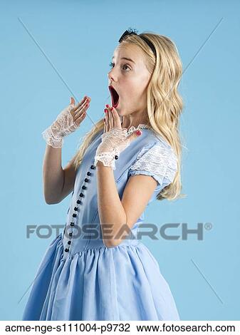Girl (10-11) in Alice in Wonderland costume for Halloween View Large Photo Image Stock Image - Girl (10-11) in Alice in Wonderland costume for Halloween. Fotosearch