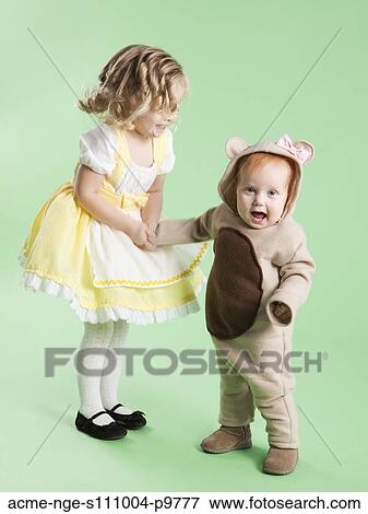 Girl (2-3) as Goldilocks with baby girl (12-17 months) as bear for Halloween View Large Photo Image Stock Photo - Girl (2-3) as Goldilocks with baby girl (12-17 months) as bear for Halloween. Fotosearch