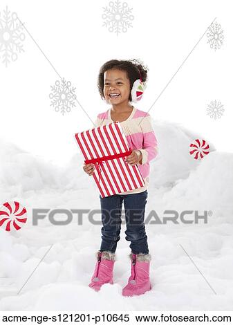 Girl (4-5) holding christmas gift View Large Photo Image Stock Photography - Girl (4-5) holding christmas gift. Fotosearch