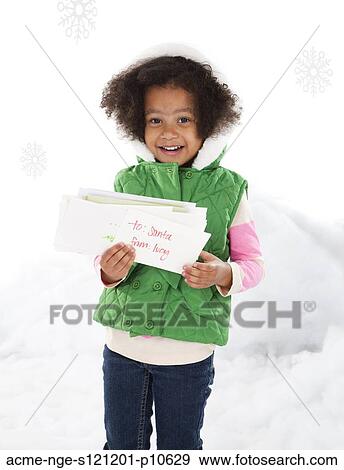 Girl (4-5) holding letter to Santa View Large Photo Image Stock Photo - Girl (4-5) holding letter to Santa. Fotosearch