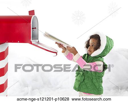 Girl (4-5) sending letter to Santa View Large Photo Image Stock Photo - Girl (4-5) sending letter to Santa. Fotosearch