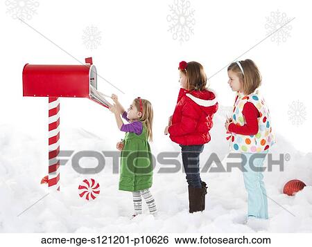 Girls (4-5, 6-7) are helping sister (18-23months) to send letter View Large Photo Image Stock Photograph - Girls (4-5, 6-7) are helping sister (18-23months) to send letter. Fotosearch