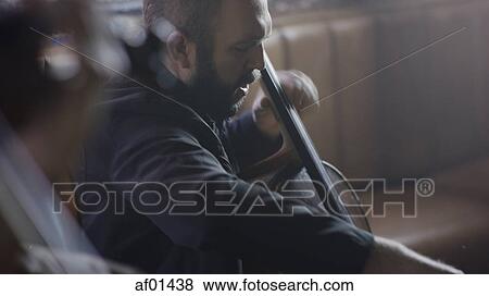 High angle selective focus view of serious musician playing bass View Large Photo Image Stock Photo - High angle selective focus view of serious musician playing bass. Fotosearch