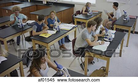 High angle view of students working together at scientific experiments in science lab classroom View Large Photo Image Stock Photography - High angle view of students working together at scientific experiments in science lab classroom. Fotosearch