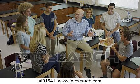 High angle view of teacher instructing students with diorama in science lab classroom View Large Photo Image Stock Image - High angle view of teacher instructing students with diorama in science lab classroom. Fotosearch
