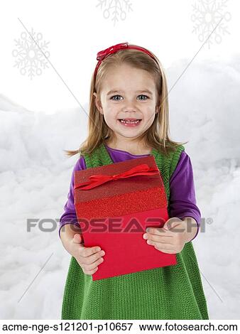 Little girl (18-23 months) holding christmas gift View Large Photo Image Stock Photo - Little girl (18-23 months) holding christmas gift. Fotosearch