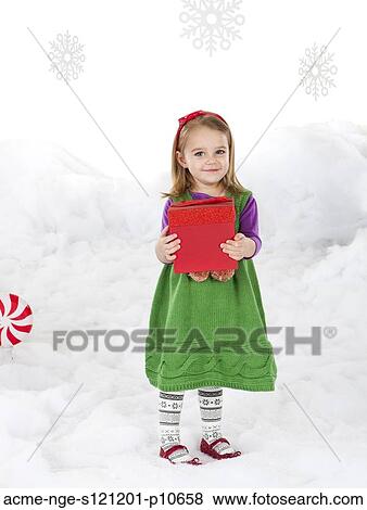 Little girl (18-23 months) holding christmas gift View Large Photo Image Stock Photo - Little girl (18-23 months) holding christmas gift. Fotosearch
