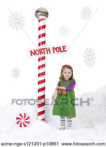 Little girl (18-23 months) standing next to North Pole sign View Large Photo Image Stock Image - Little girl (18-23 months) standing next to North Pole sign. Fotosearch