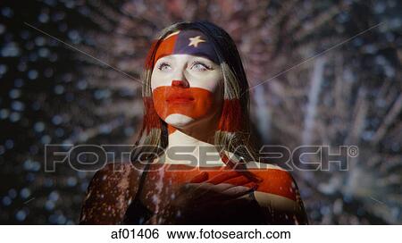 Low angle view of American flag projected on respectful woman with hand over her heart View Large Photo Image Stock Photograph - Low angle view of American flag projected on respectful woman with hand over her heart. Fotosearch