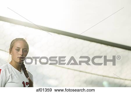 Low angle view of focused athlete standing in soccer goal under sunny sky View Large Photo Image Stock Photo - Low angle view of focused athlete standing in soccer goal under sunny sky. Fotosearch