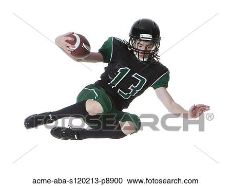 Male player of American football catching ball, studio shot View Large Photo Image Stock Image - Male player of American football catching ball, studio shot. Fotosearch