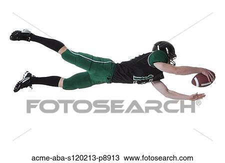 Male player of American football catching ball, studio shot View Large Photo Image Stock Image - Male player of American football catching ball, studio shot. Fotosearch