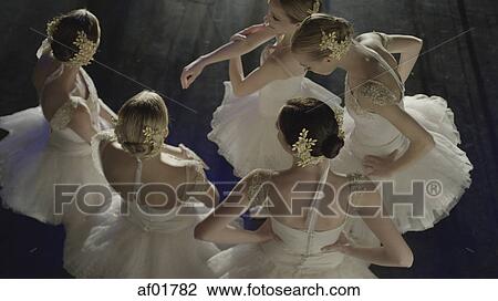 Overhead view of serious ballet dancers in costume standing backstage during show View Large Photo Image Stock Image - Overhead view of serious ballet dancers in costume standing backstage during show. Fotosearch
