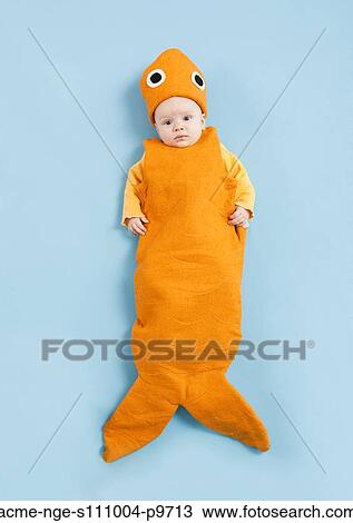 Portrait of baby boy (2-5 months) in goldfish costume View Large Photo Image Stock Image - Portrait of baby boy (2-5 months) in goldfish costume. Fotosearch