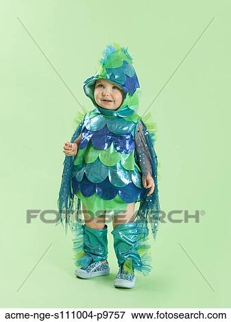 Portrait of baby girl (12-17 months) in fish costume for Halloween View Large Photo Image Stock Photo - Portrait of baby girl (12-17 months) in fish costume for Halloween. Fotosearch
