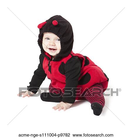 Portrait of baby girl (6-11 months) in ladybird costume for Halloween View Large Photo Image Stock Image - Portrait of baby girl (6-11 months) in ladybird costume for Halloween. Fotosearch