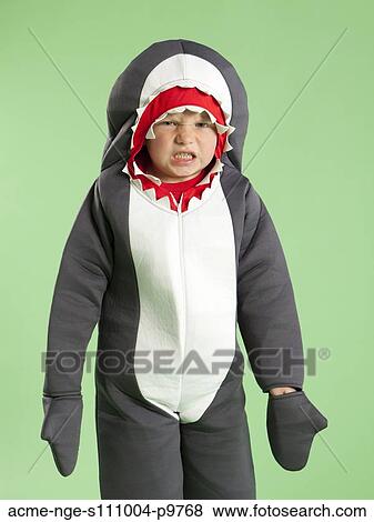 Portrait of boy (6-7) in shark costume for Halloween View Large Photo Image Stock Photo - Portrait of boy (6-7) in shark costume for Halloween. Fotosearch