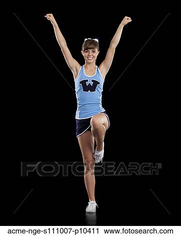 Stock Image - Portrait of teenage cheerleader girl (16-17) stretching. Fotosearch